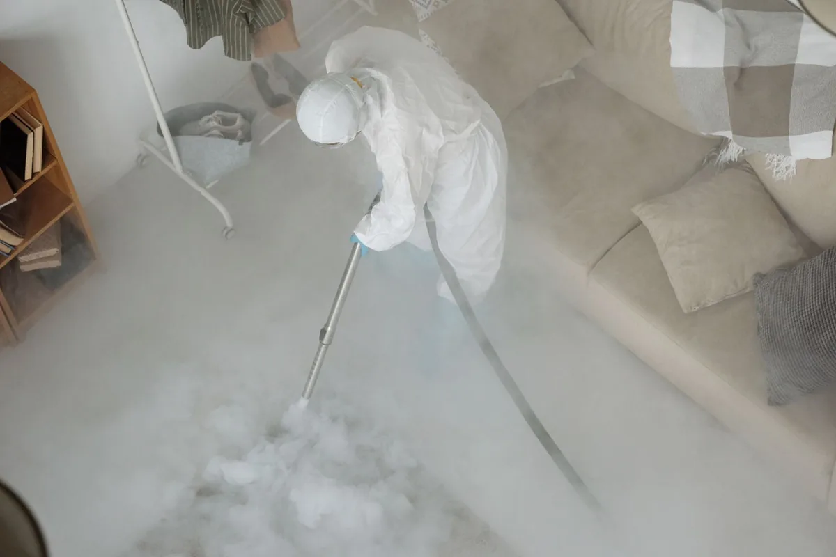 Biohazard cleanup technician in protective equipment, Upper Land Park, Sacramento, CA
